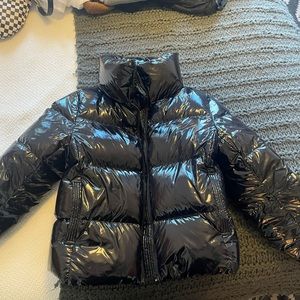 Small, Carbon puffer. It’s so warm and the pockets are very soft and comfy.